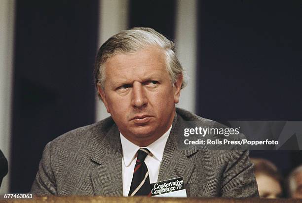 British Conservative Party politician and Minister of Agriculture, Fisheries and Food, Jim Prior pictured listening to proceedings from the platform...