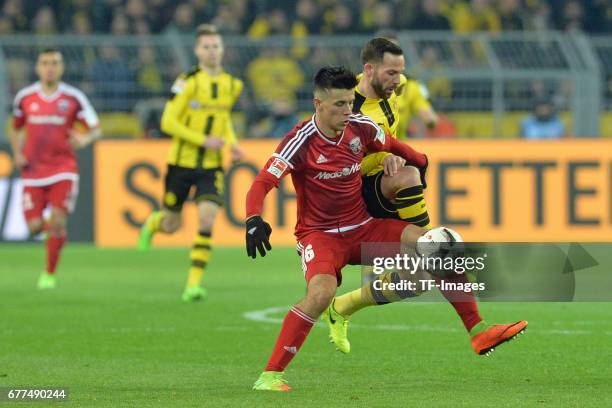 Alfredo Morales of Ingolstadt and Gonzalo Castro of Dortmund battle for the ball during the Bundesliga match between Borussia Dortmund and FC...