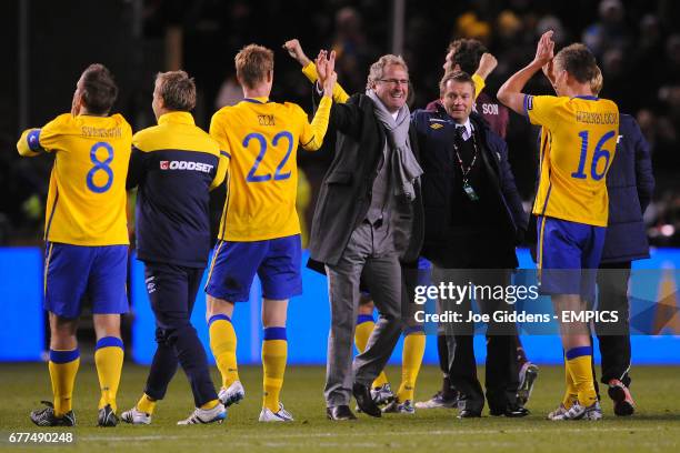 Sweden manager Erik Hamren celebrates with his player after ensuring qualification for Euro 2012