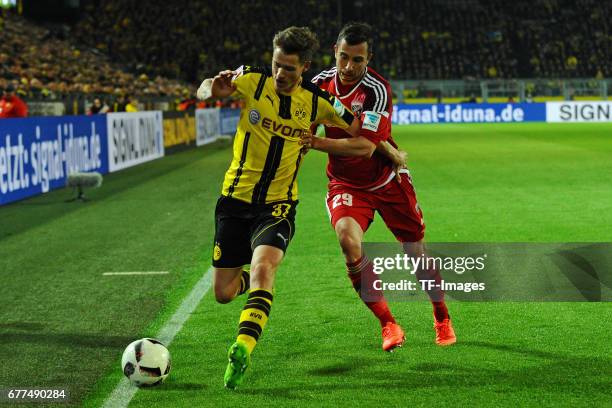 Erik Durm of Dortmund and Markus Suttner of Ingolstadt battle for the ball during the Bundesliga match between Borussia Dortmund and FC Ingolstadt 04...