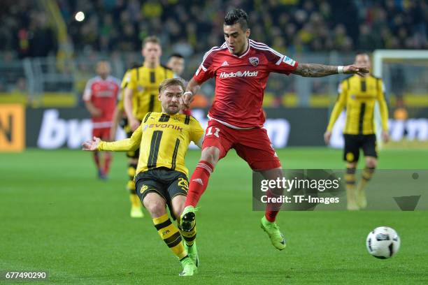 Marcel Schmelzer of Dortmund and Dario Lezkano of Ingolstadt battle for the ball during the Bundesliga match between Borussia Dortmund and FC...