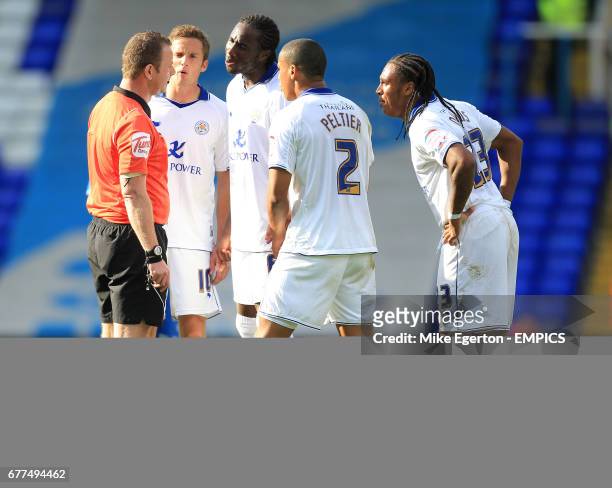 Leicester City's players surround referee Kevin Wright after he sends off Matt Mills