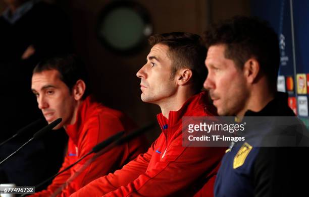 Diego Godin of Atletico Madrid , Gabi of Atletico Madrid and Head coach Diego Simeone of Atletico Madrid attends a press conference ahead the UEFA...