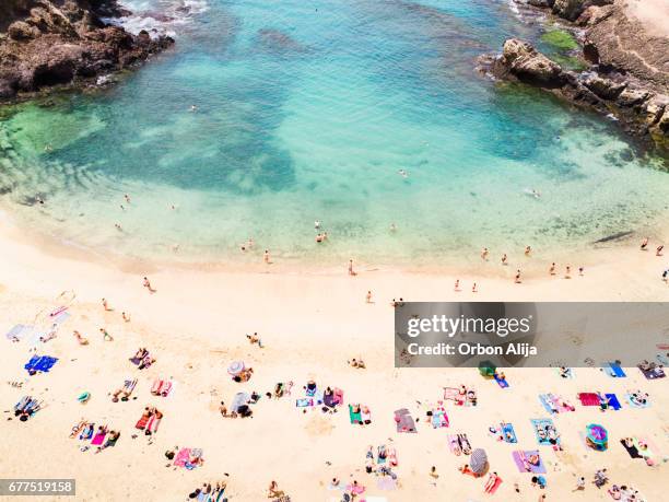 aerial view of people at the beach - lanzarote stock pictures, royalty-free photos & images