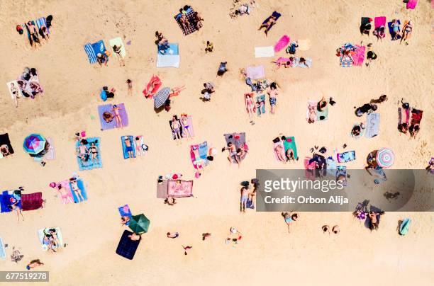 aerial view of people at the beach - crowd of people from above stock pictures, royalty-free photos & images