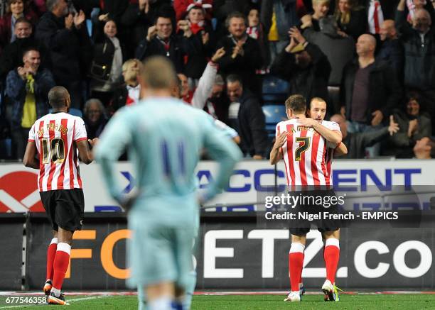 Southampton's Steve De Ridder celebrates scoring his side's fourth goal of the game with teammate Rickie Lambert