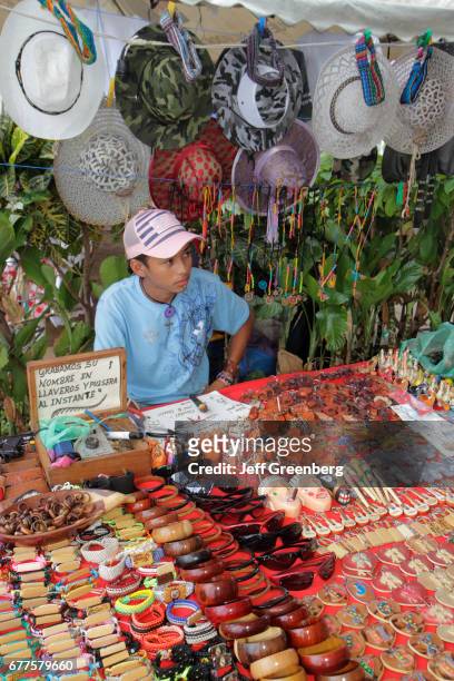 Boy selling souvenirs at Puerto Salvador Allende.