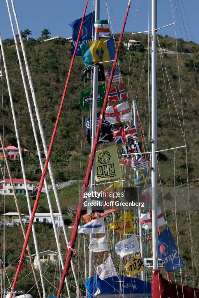 Boat masts flags in Soper's Hole Wharf and Marina.