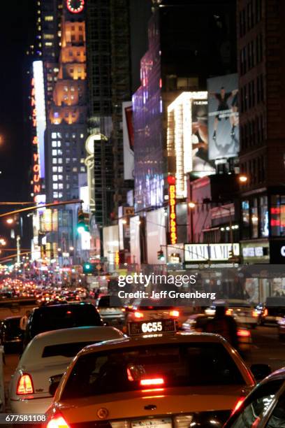Taxi cabs on 54th Street at night.