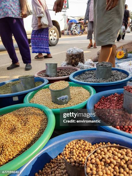 market vendor stalls selling grains at the weekly morning hilltribe market held in the centre of chiang dao town every tuesday. - vendor selling pulses in local market stock pictures, royalty-free photos & images