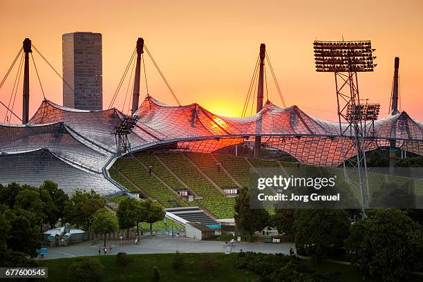 munich sunset - olympiastadion münchen stock-fotos und bilder