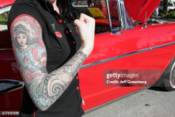 Dream Car Classic, antique, collector with tattooed arm.