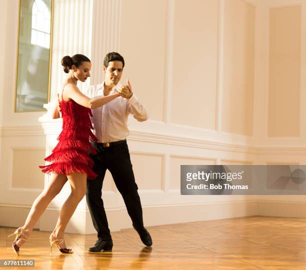 couple dancing tango - ballroom dance couple stock-fotos und bilder