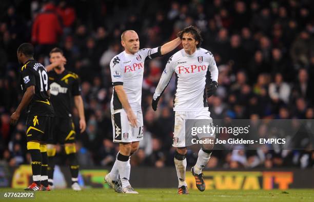 Fulham's Bryan Ruiz celebrates scoring his side's second goal of the game with teammate Danny Murphy