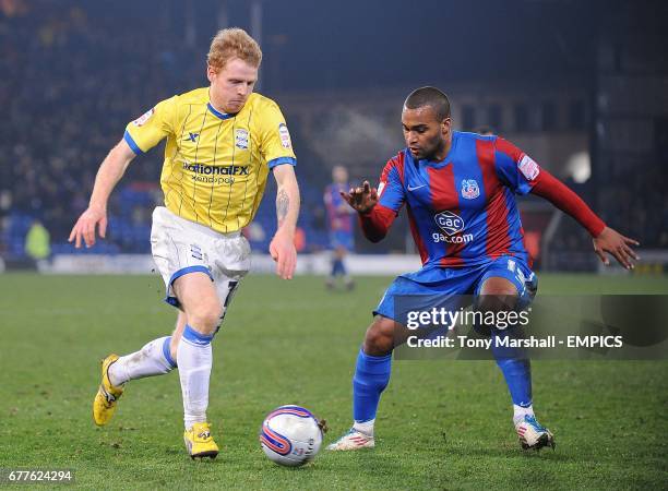 Birmingham City's Chris Burke and Crystal Palace's Jermaine Easter batle for the ball