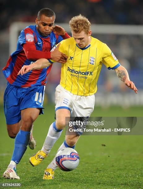 Birmingham City's Chris Burke and Crystal Palace's Jermaine Easter batle for the ball