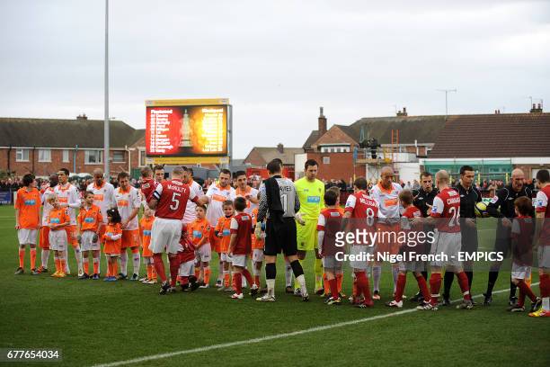 Fleetwood Town and Blackpool players shake hands prior to kick-off