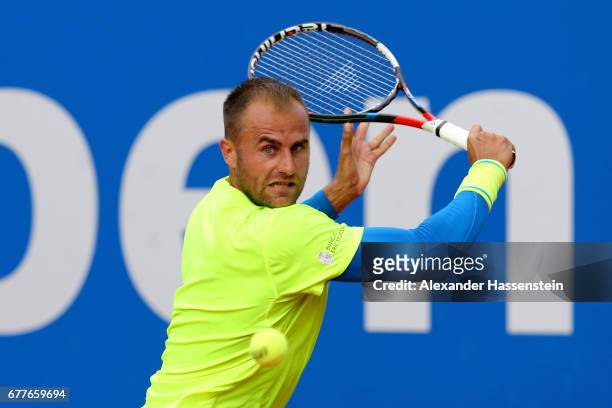 Marius Copil of Rumania plays the ball against Roberto Bautista Agut of Spain during their 2. Round match of the 102. BMW Open by FWU at Iphitos...