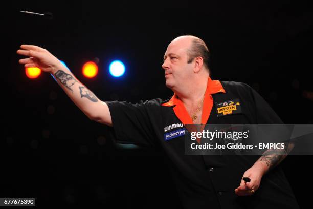 England's Ted Hankey in action against Martin Atkins in the quarter finals of the BDO World Professional Darts Championships