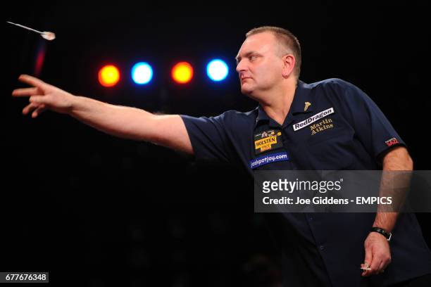 England's Martin Atkins in action against England's Ted Hankey in the quarter finals of the BDO World Professional Darts Championships