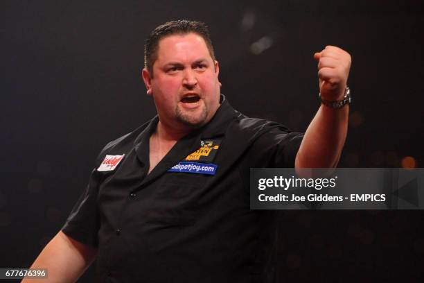 England's Alan Norris reacts during the quarter finals of the BDO World Professional Darts Championships