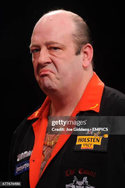 England's Ted Hankey reacts during his match against Martin Atkins in the quarter finals of the BDO World Professional Darts Championships