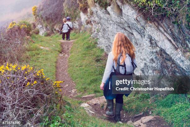 family on coastal footpath - ginger bush stock pictures, royalty-free photos & images