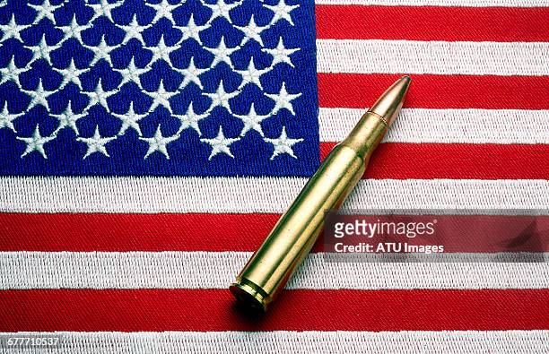 bullet flag - weapon stock pictures, royalty-free photos & images