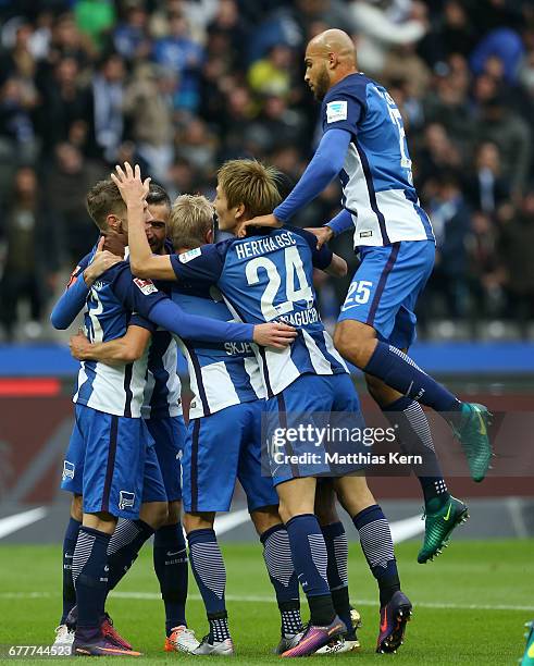 Vedad Ibisevic of Berlin celebrates with team mates after scoring the first goal during the Bundesliga match between Hertha BSC and 1. FC Koeln at...