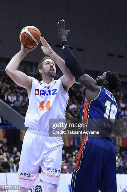 Stephan Van Treese of the Niigata Albirex BB tries to shoot under pressure from Faye Pape Mour of the Yokohama B-Corsairs during the B. League match...