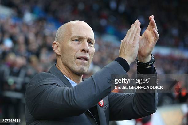 Swansea City's US manager Bob Bradley applauds supporters ahead of the English Premier League football match between Swansea City and Watford at The...