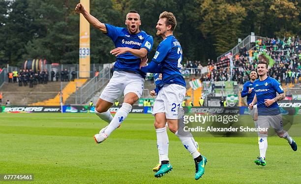 Aenis Ben-Hatira of Darmstadt celebrates the first goal for his team with Immanuel Hoehn of Darmstadt, Jerome Gondorf of Darmstadt during the...