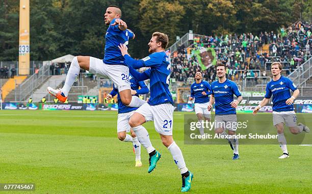 Aenis Ben-Hatira of Darmstadt celebrates the first goal for his team with Immanuel Hoehn of Darmstadt, Jerome Gondorf of Darmstadt during the...