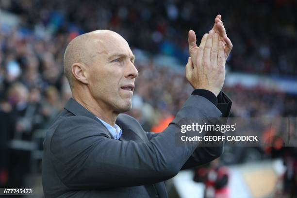 Swansea City's US manager Bob Bradley applauds supporters ahead of the English Premier League football match between Swansea City and Watford at The...