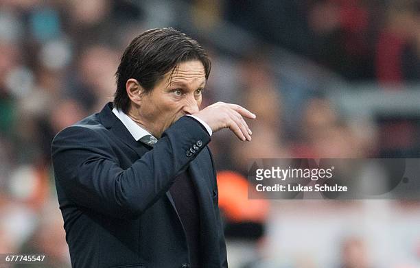 Head Coach Roger Schmidt of Leverkusen is seen on the side-line of the pitch during the Bundesliga match between Bayer 04 Leverkusen and TSG 1899...
