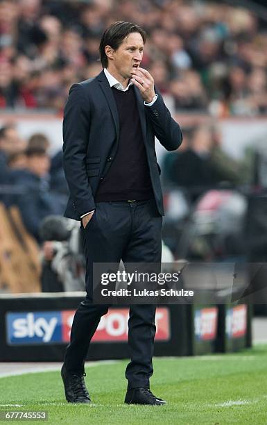 Head Coach Roger Schmidt of Leverkusen is seen on the side-line of the pitch during the Bundesliga match between Bayer 04 Leverkusen and TSG 1899...