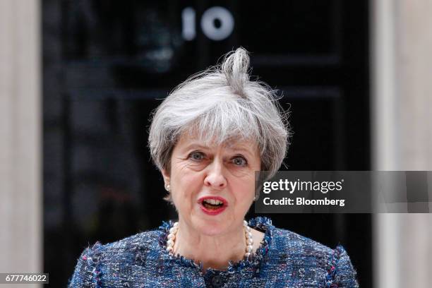 Theresa May, U.K. Prime minister, makes a statement to the media outside number 10 Downing Street after meeting Queen Elizabeth II to mark the...