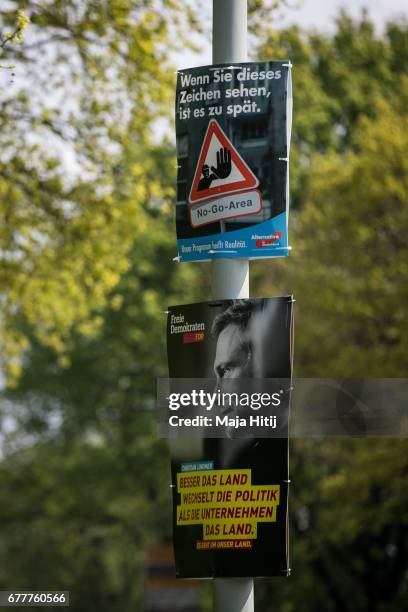 Election campaign billboards of the German Social Democrats and the Free Democratic Party are seen ahead of state elections in North Rhine-Westphalia...