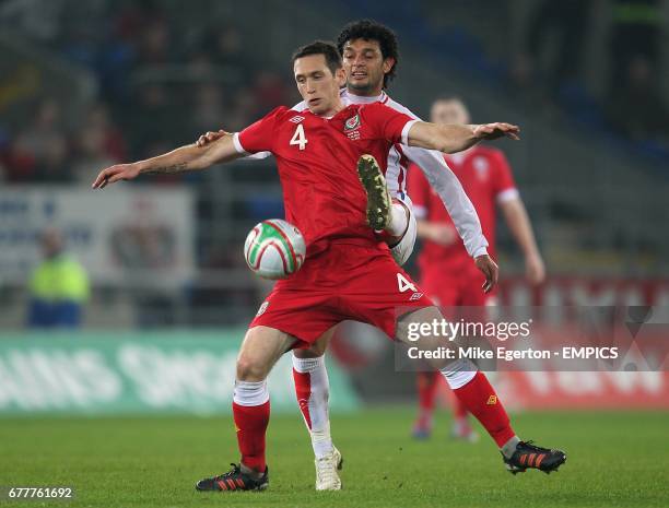 Wales' Andrew Crofts holds off Costa Rica's Michael Barrantes