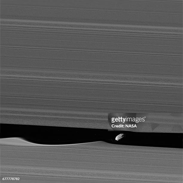 In this handout image provided by the National Aeronautics and Space Administration , the wavemaker moon, Daphnis, is featured in this view, taken as...