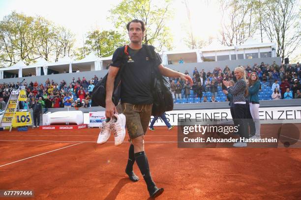 Tommy Haas of Germany leaves the centre court in a tradiotional Bavarian leather pants after his 2. Round match against Jan-Lennard Sruff of Germany...