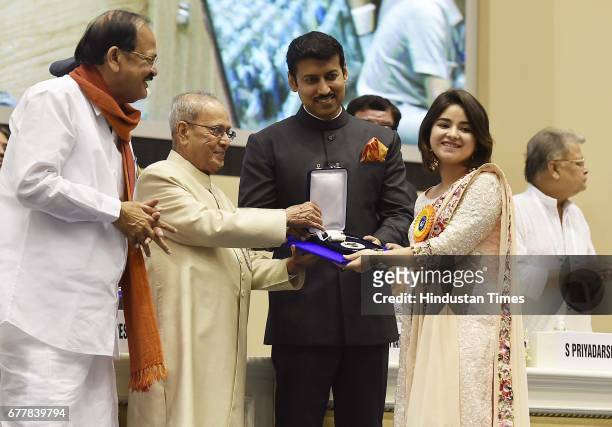 President Pranab Mukherjee presents Best Supporting Actor award to actor Zaira Wasim for movie Dangal during the 64th National Film Awards at Vigyan...