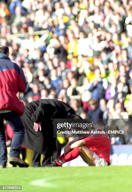 Middlesbrough's Juninho is consoled by manager Bryan Robson after they are relegated from the Premiere League