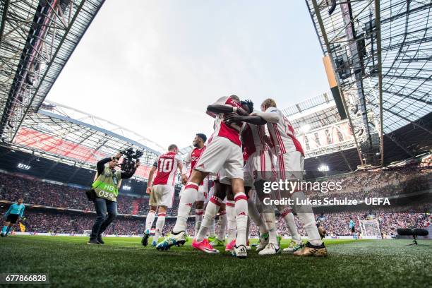 Players of Amsterdam celebrate their teams first goal during the Uefa Europa League, semi final first leg match, between Ajax Amsterdam and Olympique...