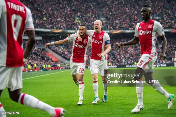 Hakim Ziyech and Davy Klaassen of Amsterdam celebrate their teams first goal during the Uefa Europa League, semi final first leg match, between Ajax...