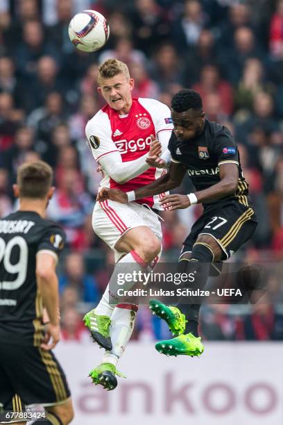 Matthijs de Ligt of Amsterdam is challenged by Maxwel Cornet of Lyon during the Uefa Europa League, semi final first leg match, between Ajax...