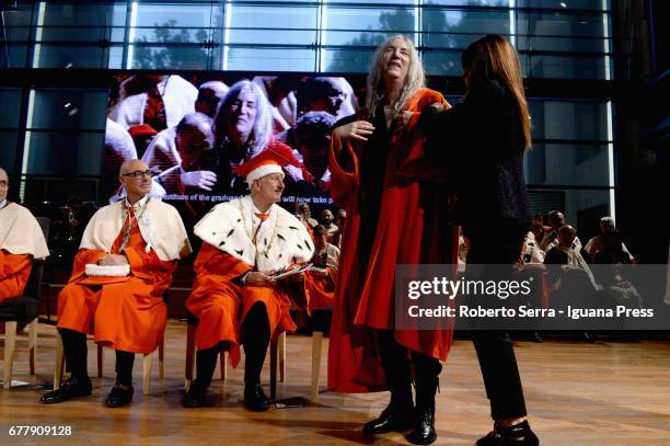 Loris Borghi, the Rector of the Parma's University confers to American musician and authoress Patti Smith an honorary degree in Literature at...