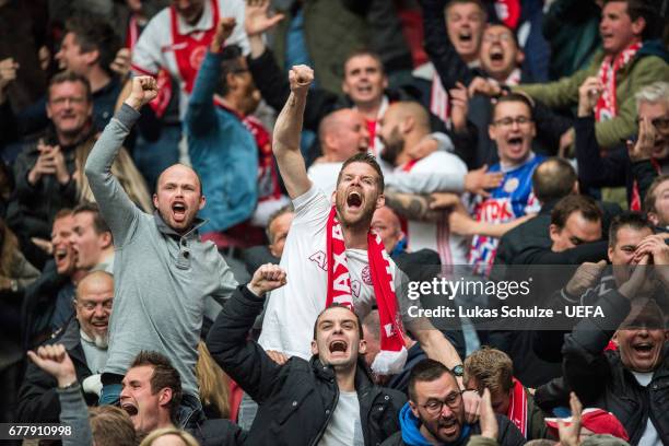 Fans of Amsterdam celebrate their teams fourth goal during the Uefa Europa League, semi final first leg match, between Ajax Amsterdam and Olympique...