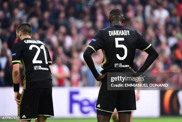 Lyon's defender Mouctar Diakhaby and Lyon's French midfielder Maxime Gonalons react during UEFA Europa League semi-final, first leg, Ajax Amsterdam v...