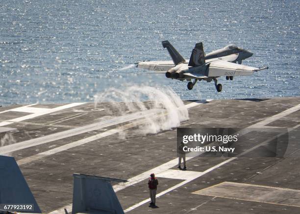 In this handout photo provided by the US Navy, An F/A-18E Super Hornet from the Kestrels of Strike Fighter Squadron 137 launches Tuesday, May 2,...